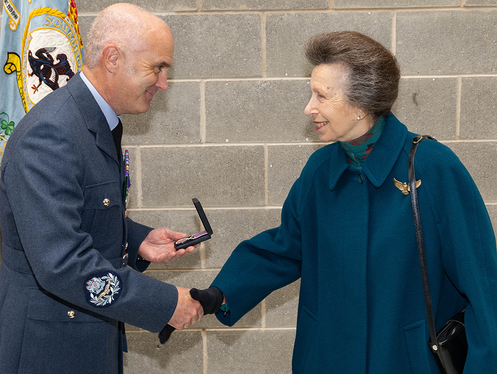 Her Royal Highness presenting a Meritorious Service Medal to Master Aircrew Russell, recognising over 32 years of exemplary service.